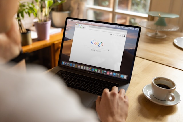 A photo of a laptop with Google search engine on screen