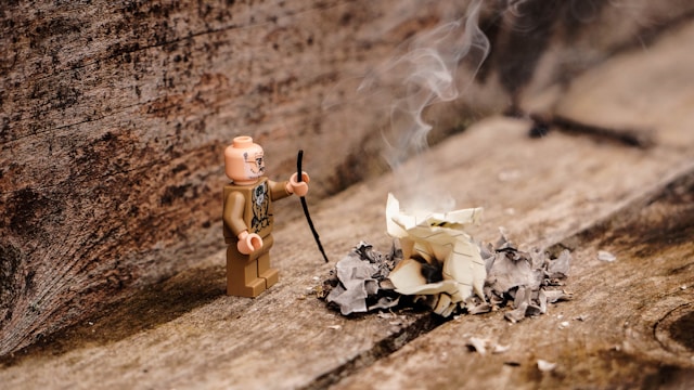 Picture of a tiny lego character making a fire as a lighthearted illustration of compressing and optimising images